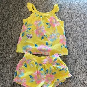 Yellow and pink spaghetti strap shirt and shorts with floral details